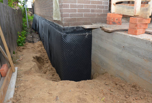 Happy homeowners after waterproofing job in Dallas